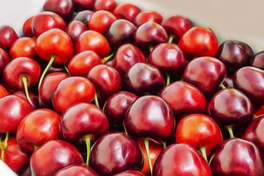close up red cherries in a box