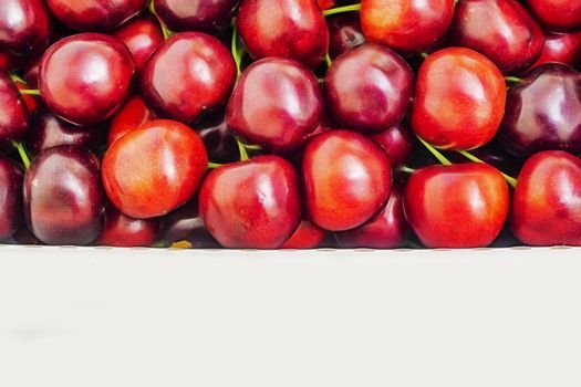 close up red cherries in a box