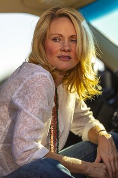 A gorgeous blonde model enjoys a spring day outdoors in the American Southwest
