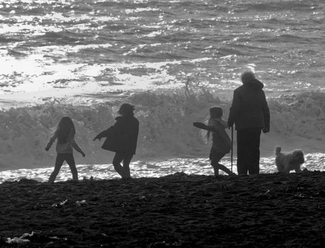 Children playing by the Ocean.