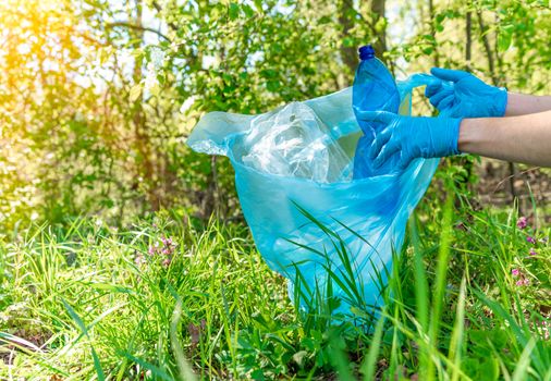 global pollution of the planet with plastic waste. Volunteers help ecology by clearing forests and meadows by collecting waste.