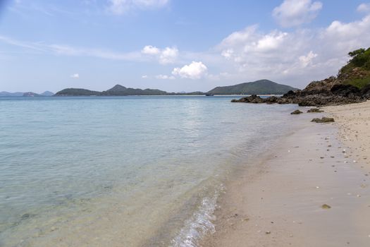 Sea wave and shore with blue sky