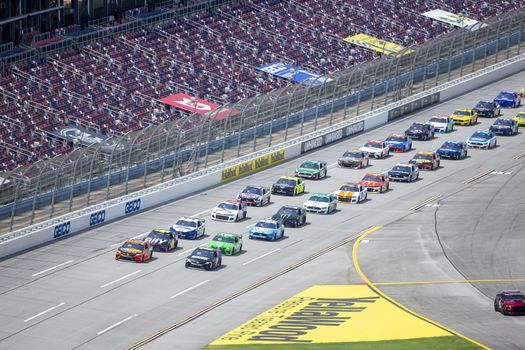 Martin Truex Jr. (19) races for position for the GEICO 500 at Talladega Superspeedway in Lincoln, Alabama.