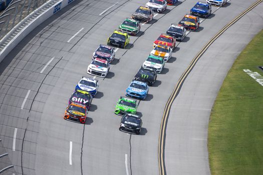 Denny Hamlin (11) races for position for the GEICO 500 at Talladega Superspeedway in Lincoln, Alabama.