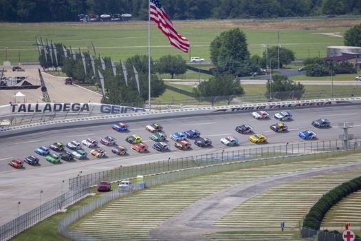 Martin Truex Jr. (19) and Denny Hamlin (11) races for position for the GEICO 500 at Talladega Superspeedway in Lincoln, Alabama.