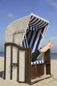 Feet of a woman in a beach chair