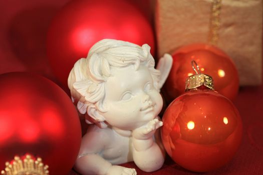 Christmas angel decoration with red baubles