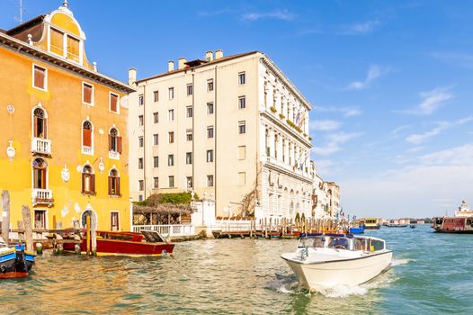 Circulation of various boats on the Grand Canal in Venice, in Veneto in the northeast of Italy.