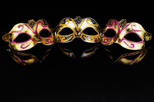 Carnival masks on black background with copy space for text