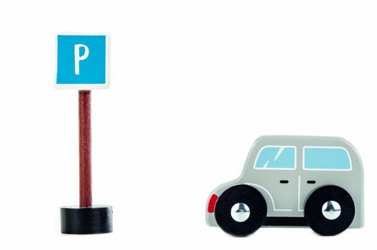 traffic sign parking and blue toy caron white background