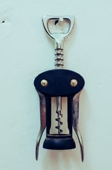 Bottle opener and corkscrew of metal