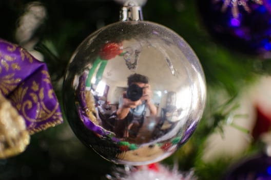 Christmas sphere hanging on a Christmas tree