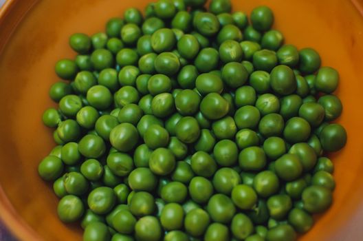 A bowl full of peas