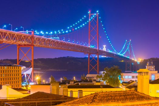 View of The 25th April Bridge (Ponte 25 de Abril) at night, Lisbon, Portugal