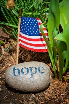 Hope message, carved on stone with USA flag