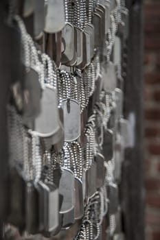 Symbolically blank soldier dog tags at a memorial