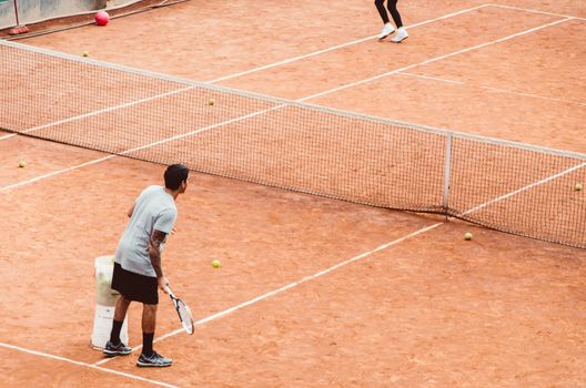 Tennis players with racket in full play