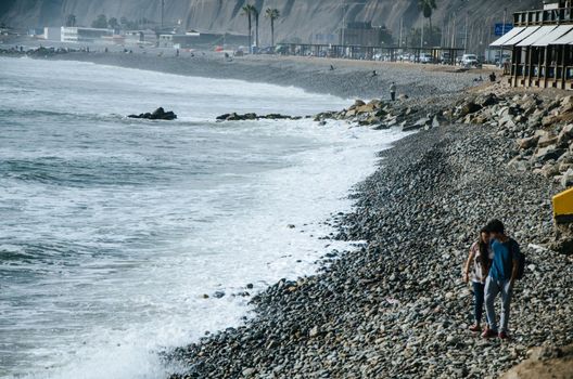Couple in love walking on the beach