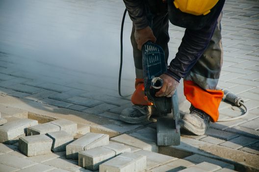 Builder of sidewalks in ravine, Lima - Peru