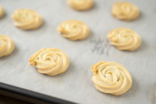 Homemade simple white chocolate cookies in baking tray