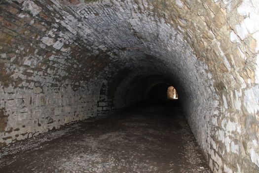 ancient dark secret passage of a castle in Italy