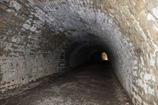 ancient dark secret passage of a castle in Italy