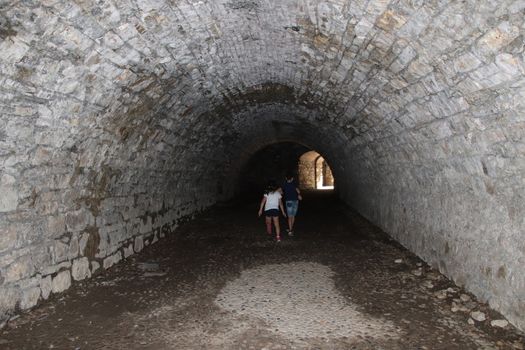 ancient dark secret passage of a castle in Italy