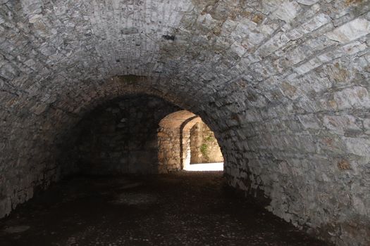 ancient dark secret passage of a castle in Italy