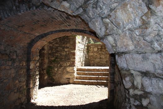 ancient dark secret passage of a castle in Italy