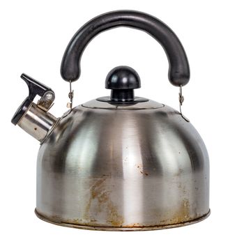 white dirty stainless steel kettle with whistle isolated on a white background.