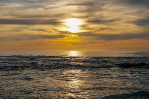 Beautiful colorful sunset over the sea, clouded sky on twilight time and reflection on the sea. in La Jolla, San Diego, California, USA