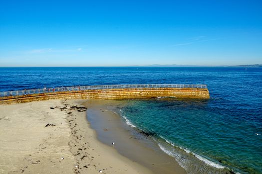 Sea lions and seals napping on a cove under the sun at La Jolla, San Diego, California. The beach is closed from December 15 to May 15 because it has become a favorite breeding ground for seals.