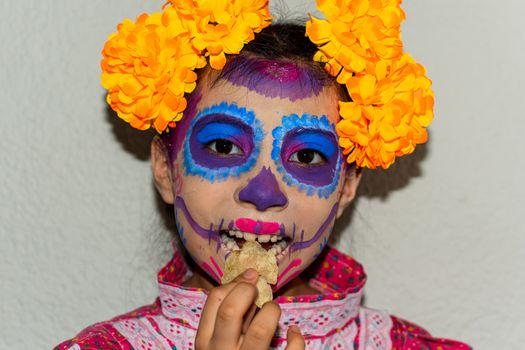portrait of girl with makeup of Katrina and eating a snack