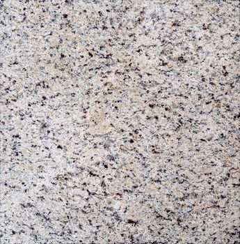Granite cut facet. Natural stone texture background.