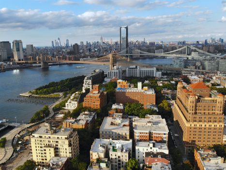 Aerial view of downtown Brooklyn with Hudson River and Brooklyn Bridge on the background. Brooklyn is the most populous of New York's five boroughs. Traditional building in Brooklyn Heights