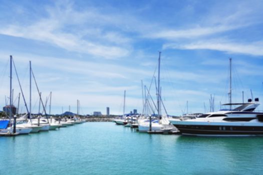 abstract blur boats docked at the yacht club background. vacation yacht for summer time concept.