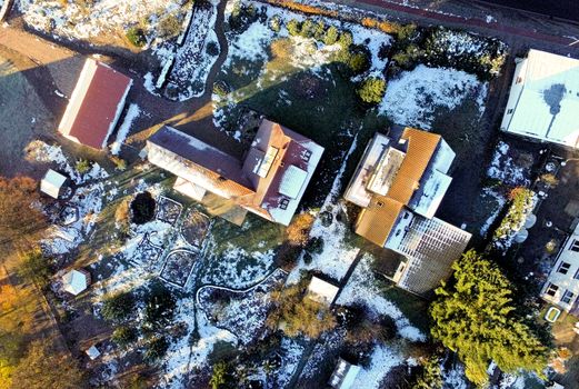 View of residential buildings and old farmhouses in a village near Celle, Germany, aerial view with drone