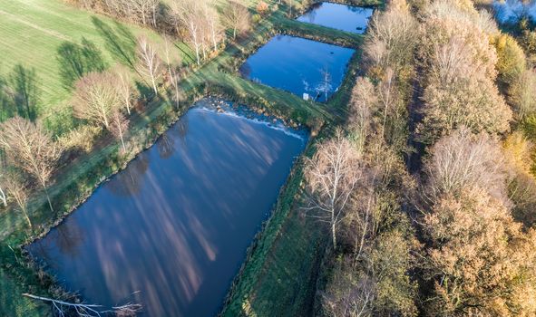 Aerial view of a trout farm with three fish farms, near Wolfsburg, Germany, aerial view with drone