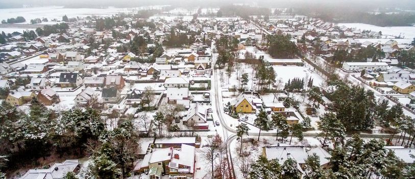 First snow in a small village in Lower Saxony, Germany, aerial view with drone