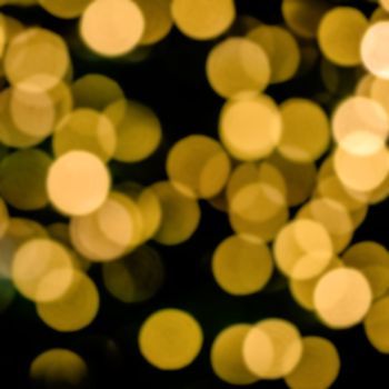 Bokeh of blurred electric candles on a christmas tree, for backgrond