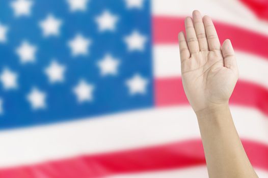 Open hand raised ,hand on USA flag background