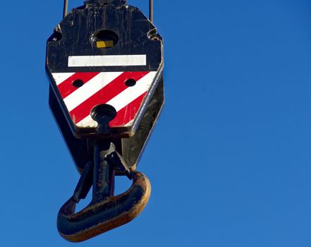 Large hook at the top end of a truck-mounted crane for lifting large and heavy loads, Germany