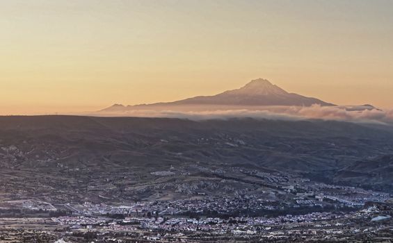 The sleeping giant, view of the volcano Erciyes near Kayseri in Anatolia, Turkey, with the villages of Cappadocia in the foreground, aerial view from the hot-air balloon.