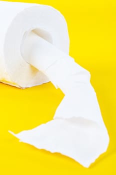 Tissue paper rolls on the yellow background.