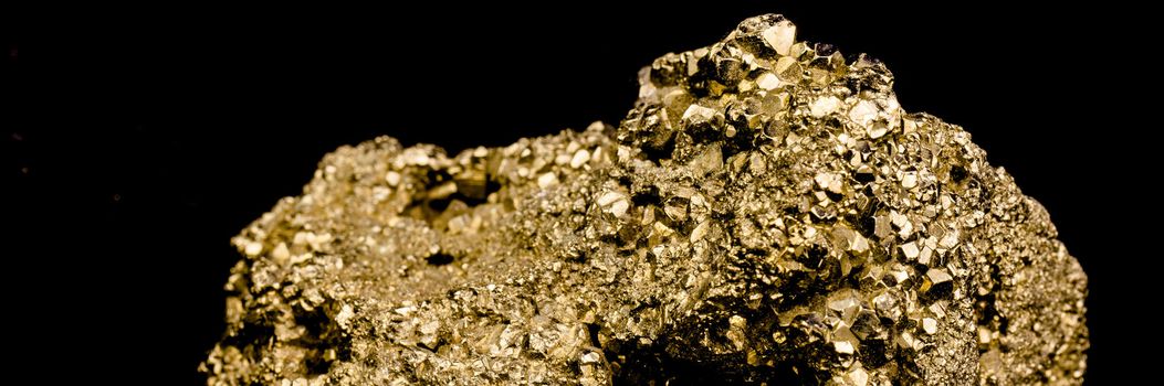 Staircase made of many cubic pyrite crystals, cropped, close-up, false gold, background black