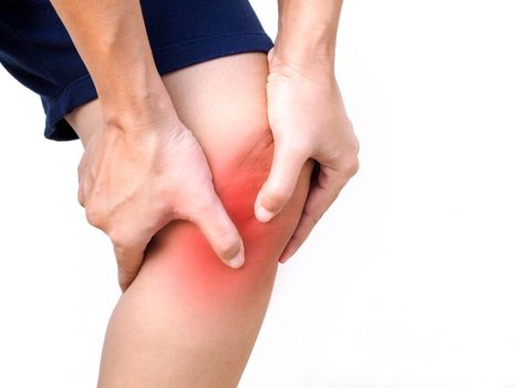 Close-up of body Thai Asian human with leg ache and knee pain, Osteoarthritis knee, chronic arthritis or gout isolated on white background.