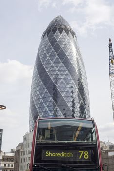 number 78 bus to shoreditch with the gherkin skyscraper in background