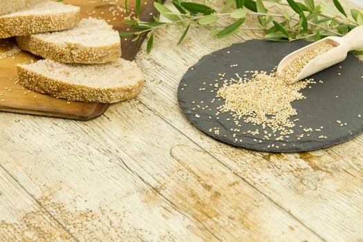 High angle view of a sliced loaf of sesame seeds homemade bread