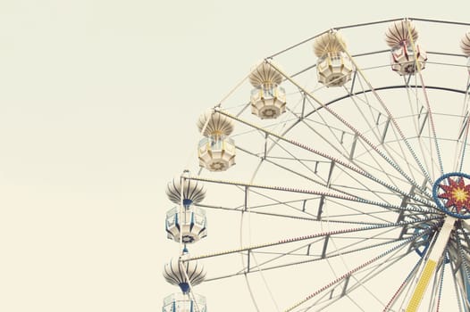 ferris wheel against blue sky, vintage filter effects
