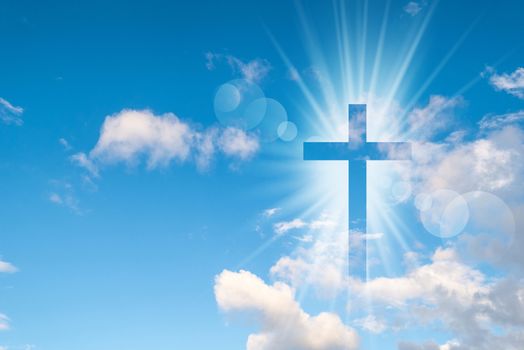 Christian cross appears bright in the sky background